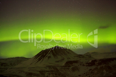 Northern lights with snowy mountains in the foreground