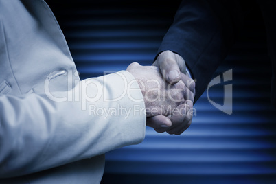 Composite image of business people shaking hands