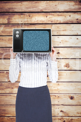 Composite image of businesswoman with box over head