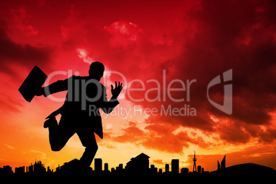 Composite image of businessman silhouette