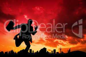 Composite image of businessman silhouette