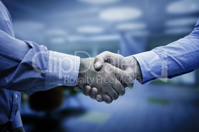 Composite image of men shaking hands