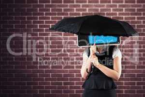 Composite image of pretty redhead businesswoman holding umbrella