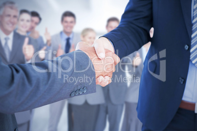 Composite image of businessmen shaking hands Composite image of businessmen shaking hands