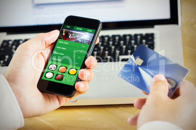 Composite image of businessman using smartphone