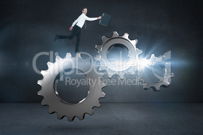 Composite image of happy businessman leaping with his briefcase