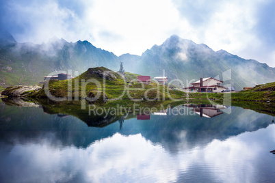 Idyllic view with typical lodge on Balea Lake