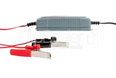 Modern electronic charger for car battery with jumper cables