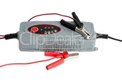 Modern electronic charger for car battery with clamps and jumper