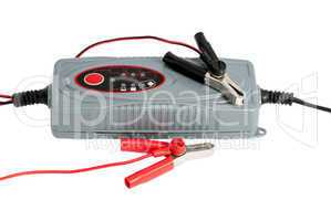 Modern electronic charger for car battery with clamps and jumper