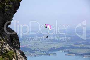 Paraglider flying over Bavarian lake Forggensee