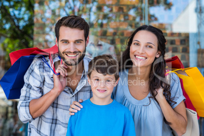 Portrait of a happy family having fun in the mall