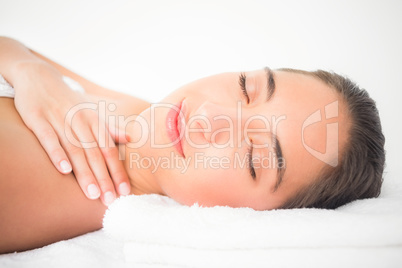 Beautiful young woman on massage table at spa center