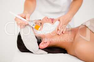 Attractive woman receiving treatment at spa center