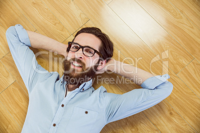 Handsome hipster lying and smiling