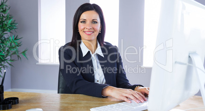 Businesswoman working at her desk