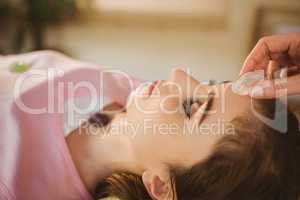 Young woman at crystal healing session