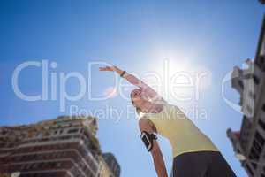 A beautiful woman stretching her arms
