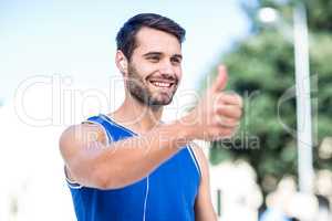 An handsome athlete thumbs up