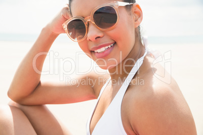 Smiling woman sunbathing in bikini