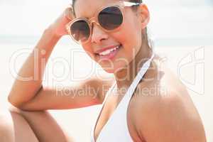 Smiling woman sunbathing in bikini