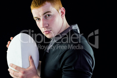 Rugby player holding a rugby ball