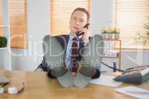 Relaxed businessman making a phone call