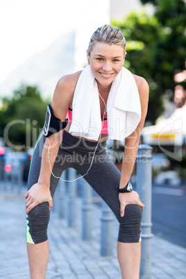 A beautiful athlete resting with a towel