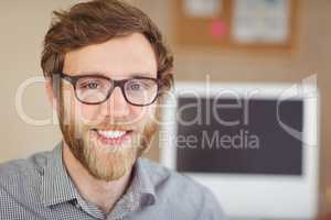 Bearded hipster smiling at camera