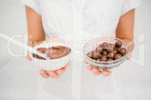 Woman having chocolate to do a masage