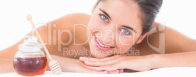 A portrait smiling pretty brunette on massage table