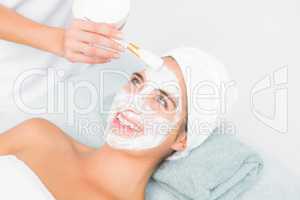 Attractive woman receiving treatment at spa center