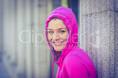 A woman wearing a pink jacket