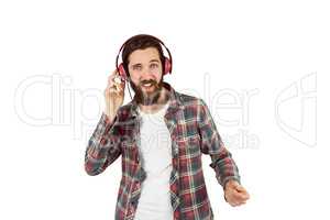 Handsome hipster enjoying listening to music