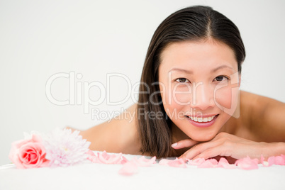 Relaxed woman lying on the massage table