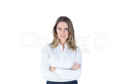 Businesswoman looking sad with her arms crossed