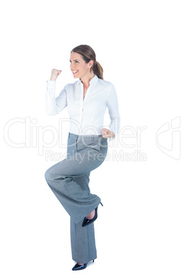 Businesswoman doing a victory pose