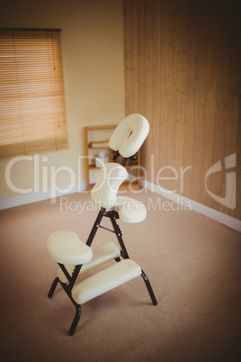 Massage chair in empty room