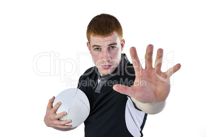 Rugby player gesturing stop sign