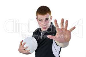 Rugby player gesturing stop sign