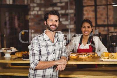 Smiling customer leaning on the counter