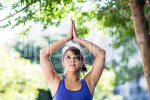 Peaceful athletic woman doing yoga