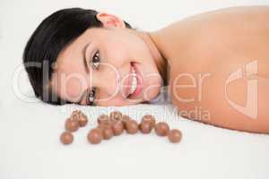 Beautiful young woman on massage table