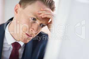 Worried businessman working at his desk