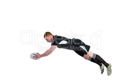 A rugby player scoring a try