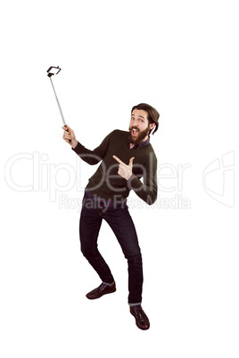 Hipster using his seflie stick