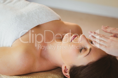 Young woman having a reiki treatment