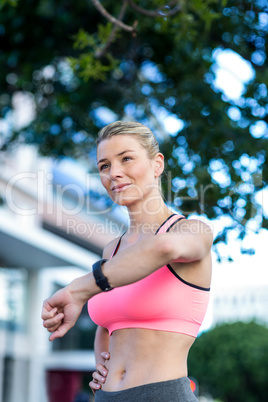 A beautiful athlete watching her watch