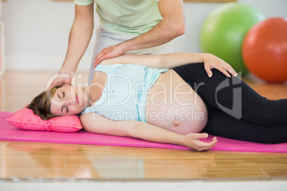 Pregnant woman having relaxing massage