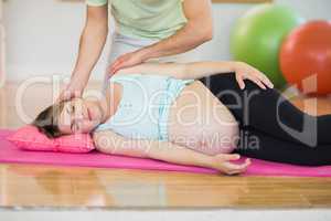 Pregnant woman having relaxing massage